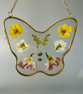 Butterfly with pressed flowers
